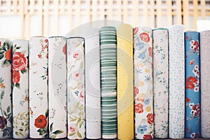 pile of rolled up wallpapers in varying patterns