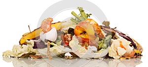 Pile of rotting food waste is isolated on white background.