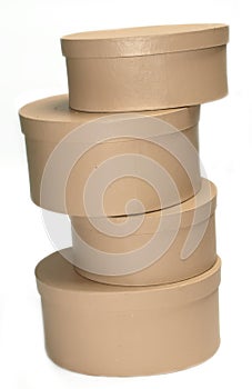 A pile of round boxes against a white background