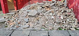 pile of rubble in front of the shophouse photo