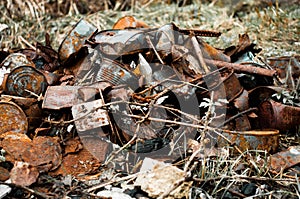 Pile rusty cans garbage on nature