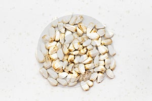 Pile of safflower seeds close up on gray