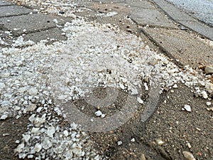 A pile of salt on the street used to melt snow