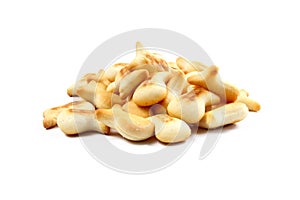 Pile of salty crackers isolated on white background. Fish shaped snack