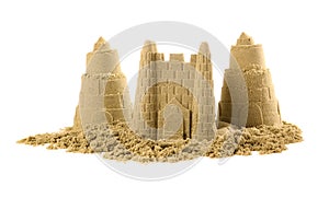 Pile of sand with beautiful castles isolated on white