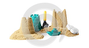 Pile of sand with beautiful castles and plastic toys isolated on white