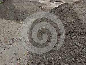 a pile of sand at a construction project site