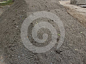 a pile of sand at a construction project site