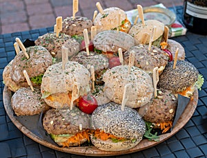 Pile of sandwiches struffed with meat and vegetables