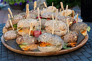 Pile of sandwiches struffed with meat and vegetables