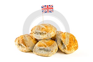 Pile of sausage rolls with union jack flag