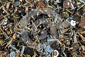 Pile of screws - abstract industrial background