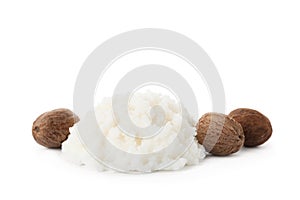 Pile of shea butter and nuts on white