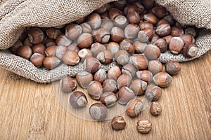 A pile of Shelled hazelnuts in a sack. Healthy food dried nuts. close-up