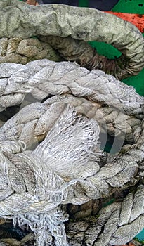 Pile of ship& x27;s mooring ropes on deck