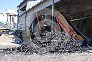 Pile of shredded rubber tires outdoors during daylight