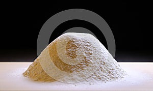 A pile of sifted flour on the kitchen table