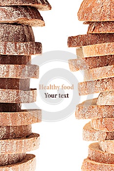 Pile of slices of black rye bread and white bread with a crispy crust on a white background. Decorative ending, border. Isolated.