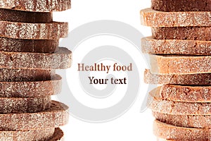 Pile of slices of black rye bread and white bread with a crispy crust on a white background.