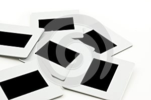 Pile of slides with frames on llightbox.