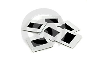 Pile of slides with frames on llightbox.