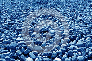 Pile of small gravel stones in navy blue tone