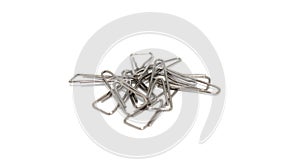 A pile of small steel paper clip for office supplies.