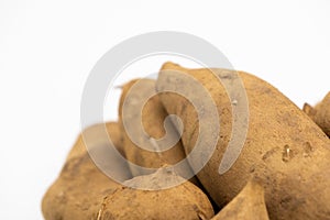 Pile of smallanthus sonchifolius or yacon or snow lotus isolated on white background