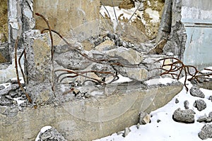 Pile of smashed asphalt rubble and rusty rebar steel