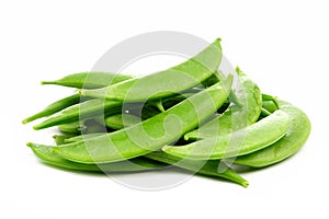 Pile of snap peas, side view isolated on white