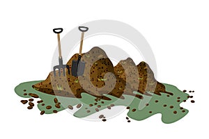 Pile of soil isolated on white background. Hayfork and shovel in a pile of ground.