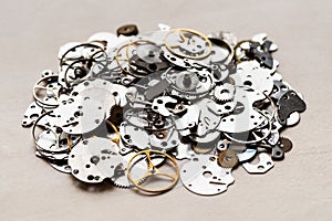 pile of spare-parts for mechanical clocks closeup