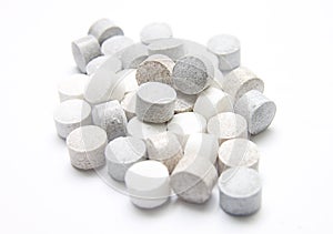 Pile of Speckled Tablets