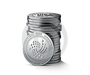 Pile or stack of silver IOTA coins isolated on white background. One coin is turned towards the camera. photo