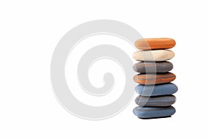 A pile, stack, tower of spa stones, simple treatment zen scene abstract symbol, copy space background. Rubber like zen pebbles