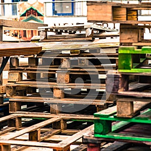 Pile or Stack of Used Empty Wooden Transport Pallets