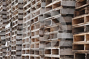 Pile or stack of wooden cargo pallets ready for shipping