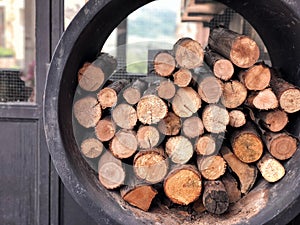 pile of stacked firewood, prepared for cooking pizza in the Restaurant