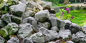 Pile of stacked lime stone rocks in close up beautiful garden decoration texture background