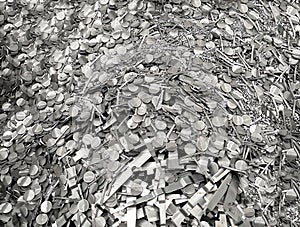 Pile of steel scrap, scrap from cold stamping sheet metal cutting process, punching waste, material for recycling photo