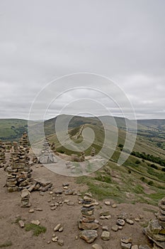 Pile of stone cairns on a hill in the Peak District, Derbyshire, UK