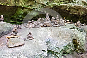 Pile of stones on huge rock known as cairns or apachites, rock formation