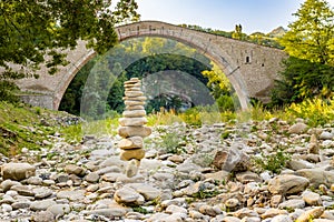 Pile of stones and hunchback bridge