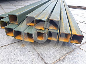 Pile of structural steel square tubes