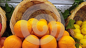 pile of sunkist fruit in supermarket photo