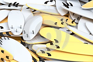Pile of surfboard for summer surfing isolated on yellow background.