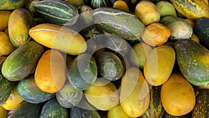 A pile of suri cucumbers ready to be sold in a fruit shop