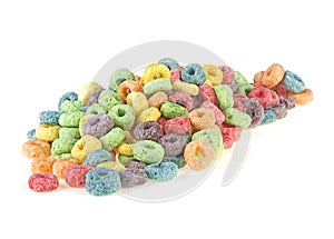 Pile of sweetened corn cereals isolated on white background. Delicious and nutritious fruit cereal loops. Colorful corn rings.