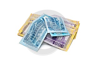 A pile of thousand and hundred taka bangladesh banknotes on an  white background