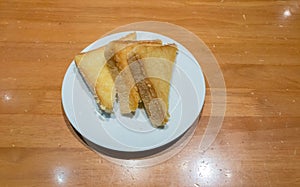 Pile of toasted bread slices on a single white plate. High energy and nutrient for breakfast